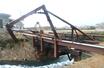 強風の影響で倒壊したトラス橋＝１３日、佐渡市相川地区