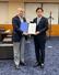 　日本財団の尾形武寿理事長（左）から「ワーク・ダイバーシティ」の実現に向けた提言書を受け取る福岡資麿厚生労働相（当時）＝２０２５年４月