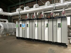都市ガスに燃料転換した原山化成工業・見附柳橋工場のボイラー設備=見附市(同社提供)