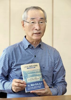 インタビューに答える竹石松次さん=新潟市中央区