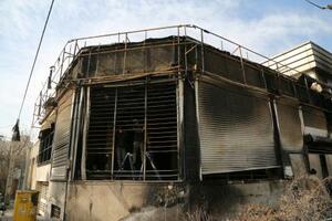 21日、イラン・テヘランで損傷した建物(ゲッティ=共同)