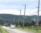 突風で傾いた道路脇の電柱=11日、上越市三和区三村新田