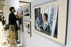 幼少期から拉致被害に遭うまでの横田めぐみさんの写真などを紹介するパネル展の設置作業=12日、新潟市中央区