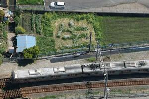 尼崎JR脱線事故現場近くの畑に浮かぶ「生」の文字=11日午前11時6分、兵庫県尼崎市(共同通信社ヘリから)