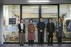 「基町プロジェクト」の活動拠点の前に立つメンバー。左から笠井美里さん、増田純さん、中村圭さん、原琉太さん、平石ももさん。増田さんは2025年3月までスタッフを務め、ほかの4人は現役=2025年4月(基町プロジェクト提供)