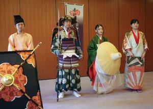 時代祭を前に、公開された(左2人目から)楠木正成の家来役のよろい、常盤御前の衣装など=6日午前、京都市左京区